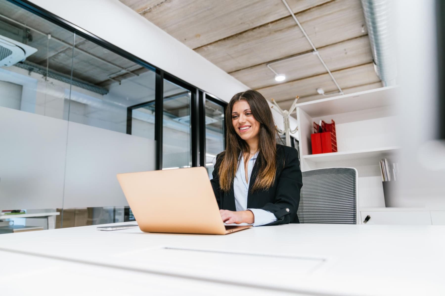 Professional working remotely in a modern office while exploring Spain’s Digital Nomad Visa